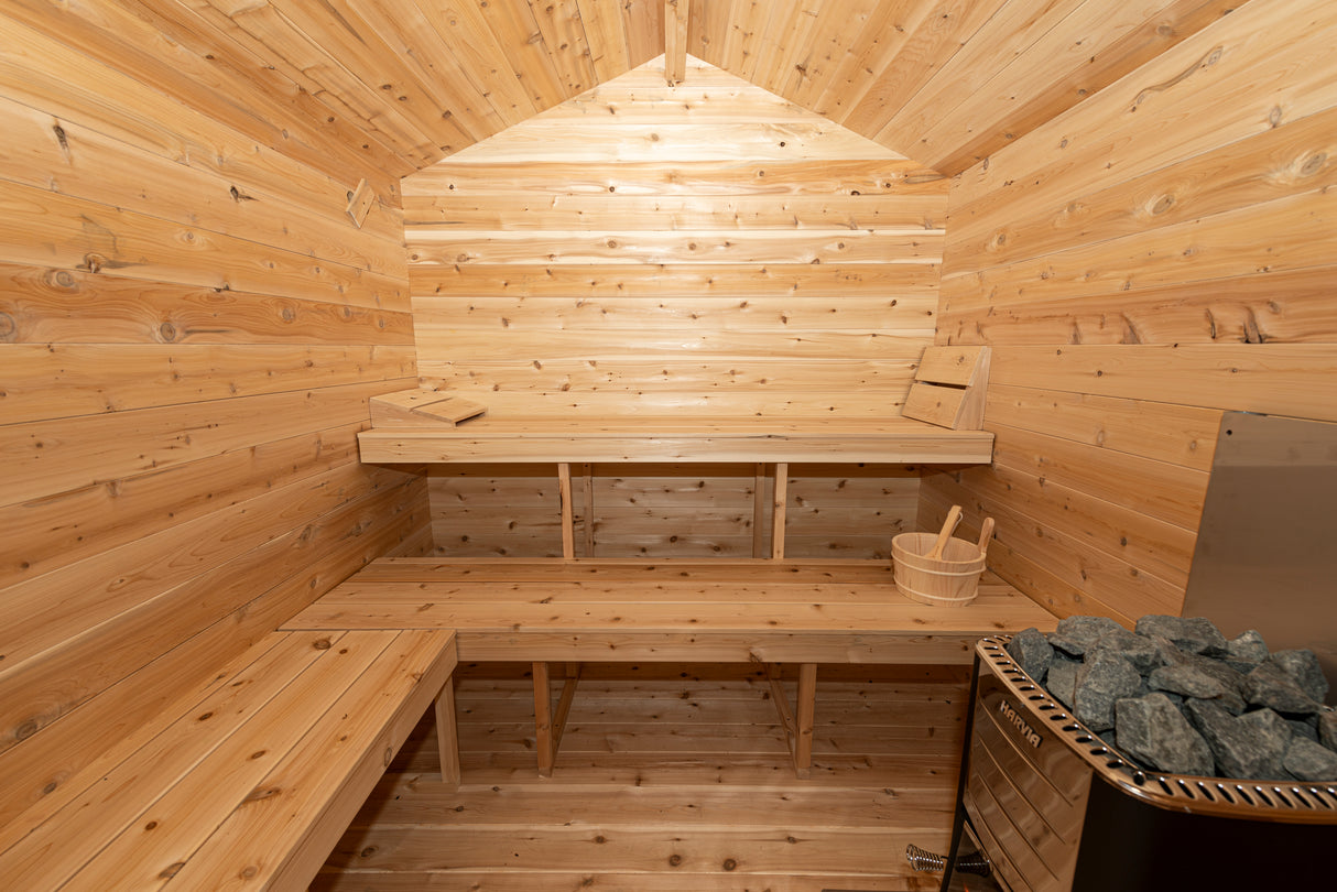 Interior of Dundalk Leisurecraft Canadian Timber Georgian Cabin Sauna with Changer in Aurora Sanctuary - Relaxation and Luxury in a Wooden Sauna Setting