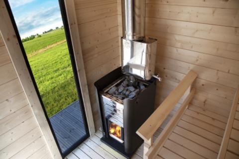 Harvia Wood Burning Sauna Stove | The Pro 36 Sauna Wood Burning Heater producing steamy sauna heat